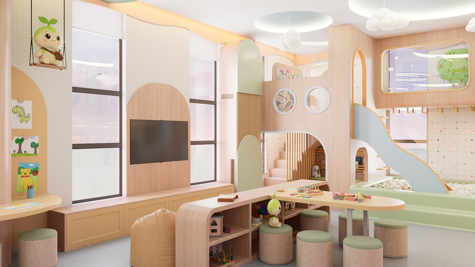 The activity area at Lyfe Playhouse: low tables with round stools, an open storage unit at child height, a screen on a wood panel between tall windows, and the slide and ball pit visible through to the right.