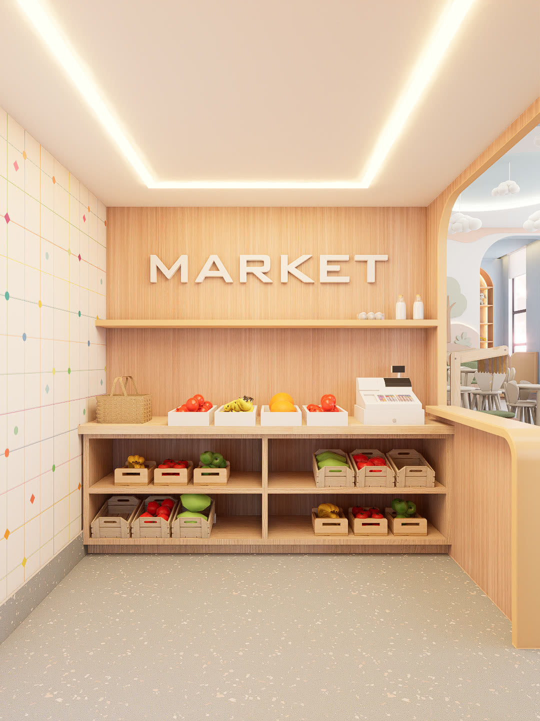 A play market at Lyfe Playhouse: a wood counter with a toy cash register, crates of fruit and vegetables on open shelves, and MARKET in raised letters on the wall above.